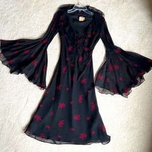 NWOT Ruffled trim plunge neck faux wrap midi dress with long bell sleeves. Sz5/6